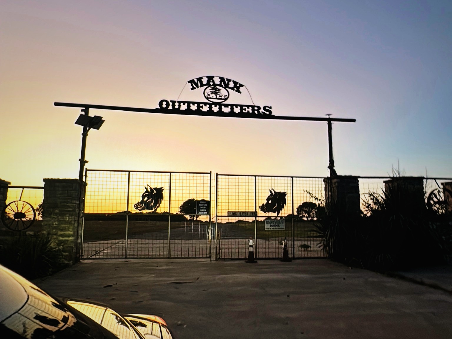 Manx Outfitters Ranch entrance at sundown