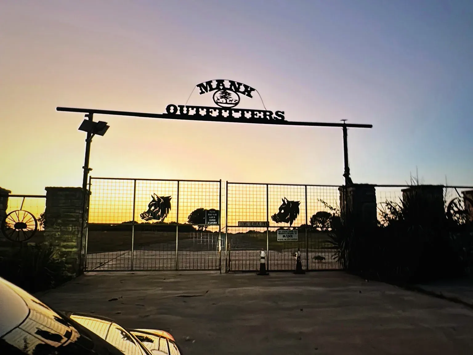Manx Outfitters Ranch entrance at sundown